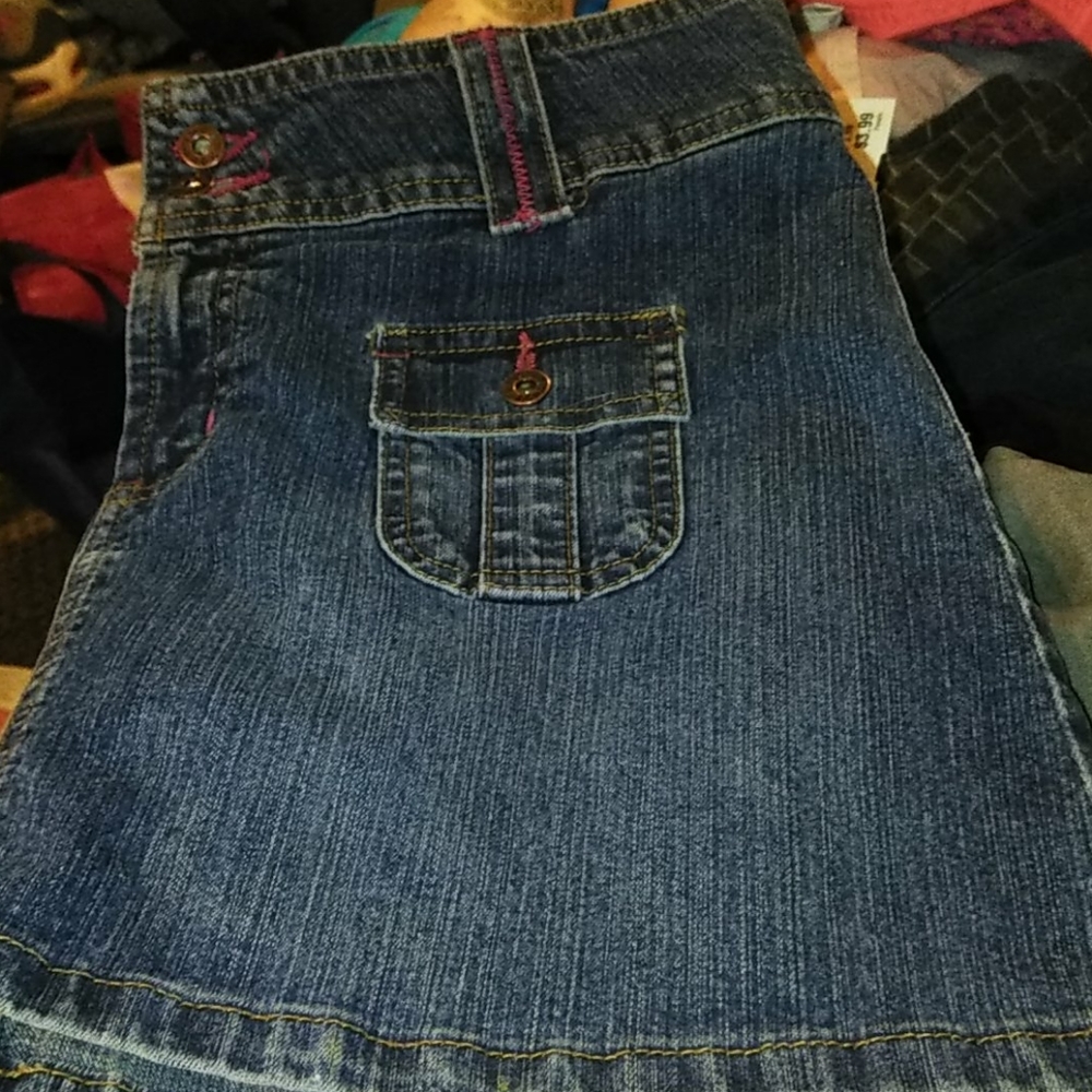Mini skirt with cute little packets on the front.